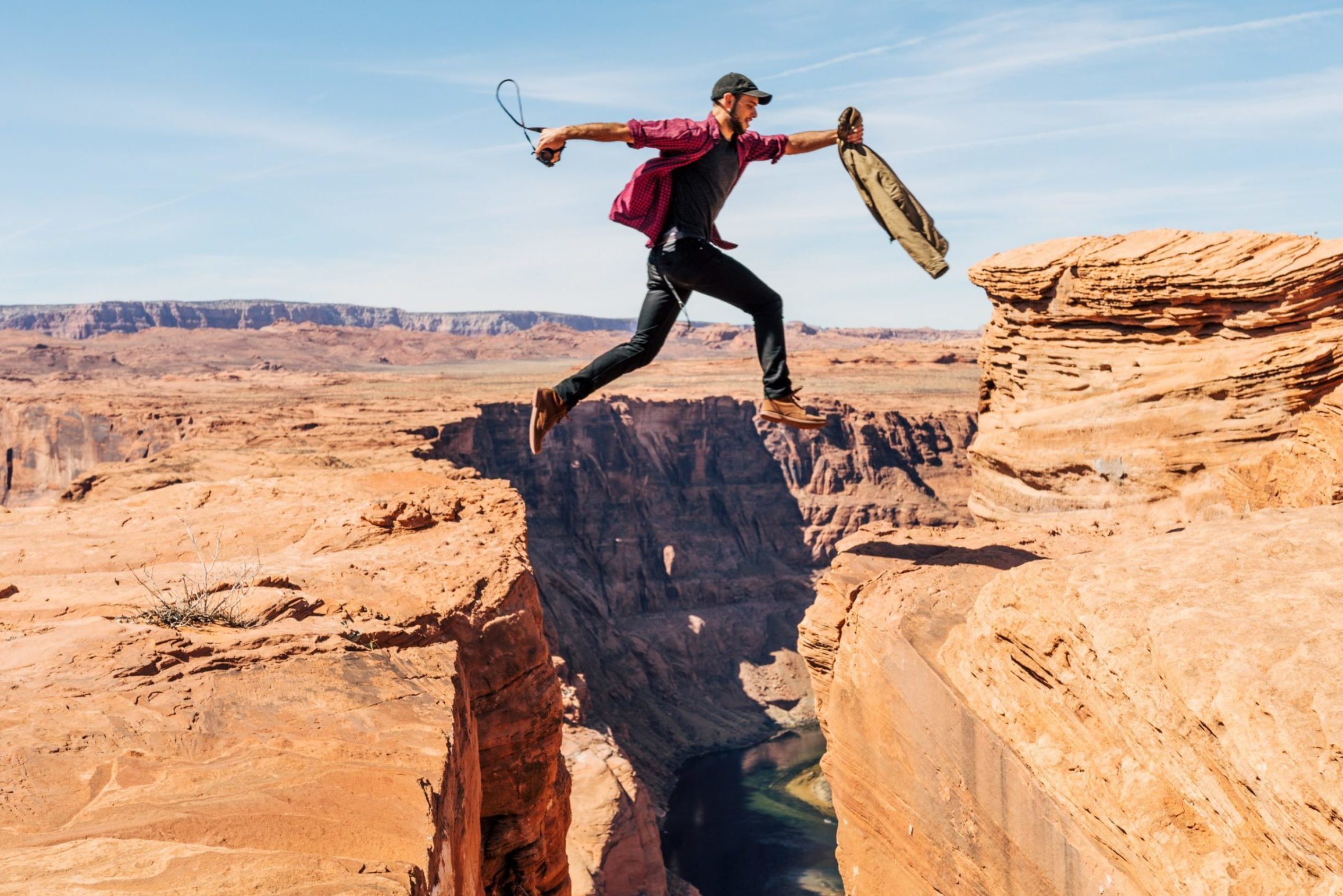 Image of someone jumping between cliffs.
