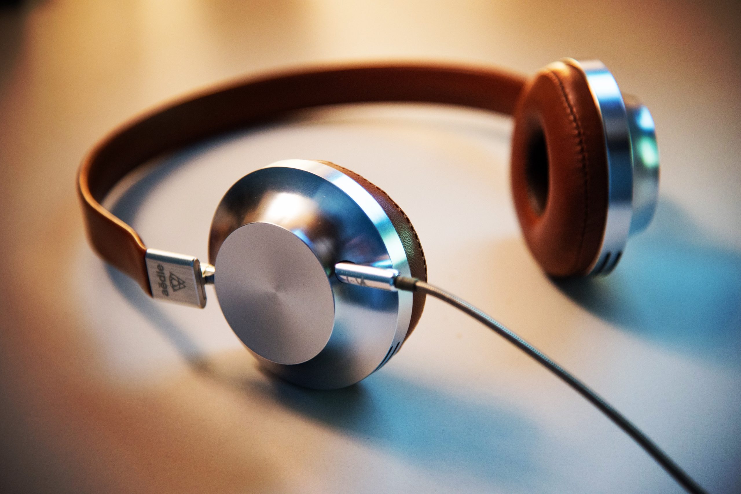 Image of headphones on a desk.