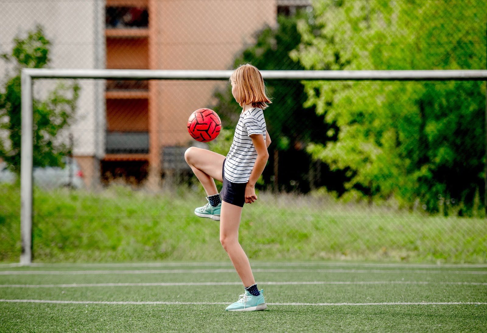 girl playing soccer