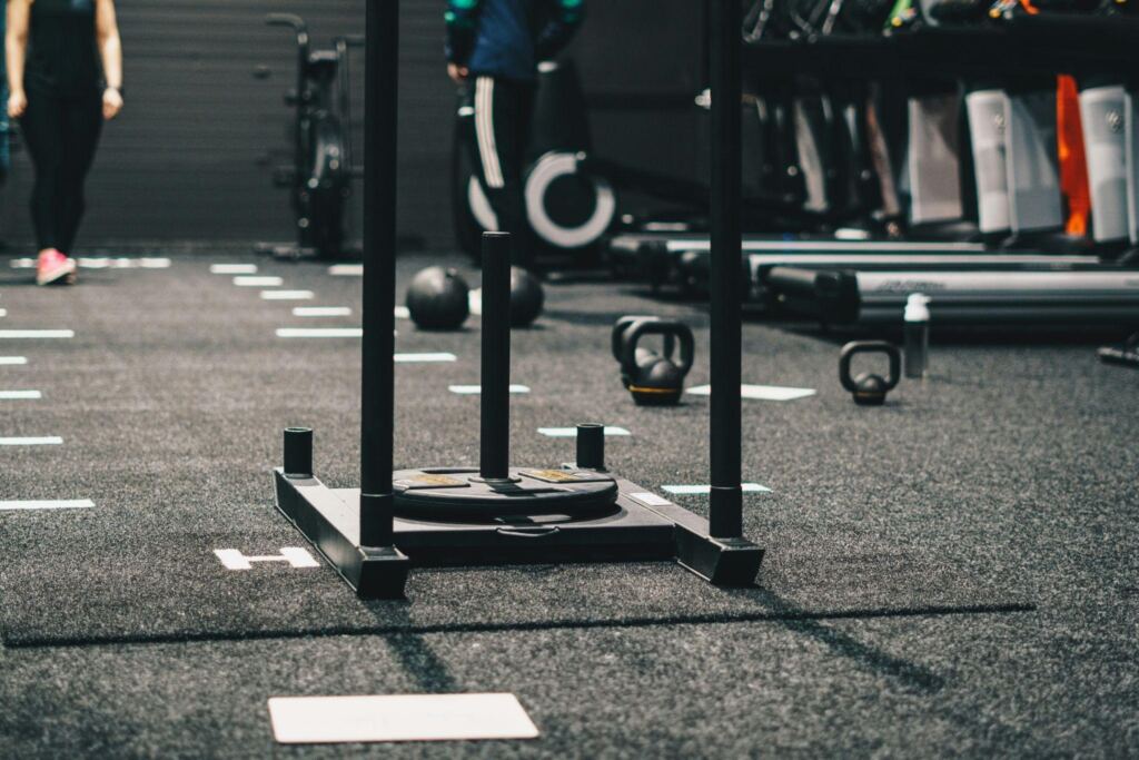 Close-up of sled push equipment used for strength and endurance training in a tactical conditioning program.
